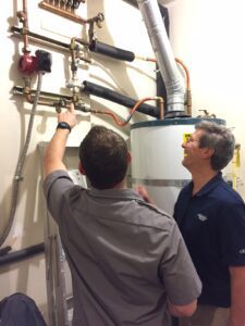 Jeff Pelton, educating on water heater inspection