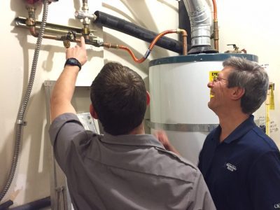 Jeff Pelton, educating on water heater inspection